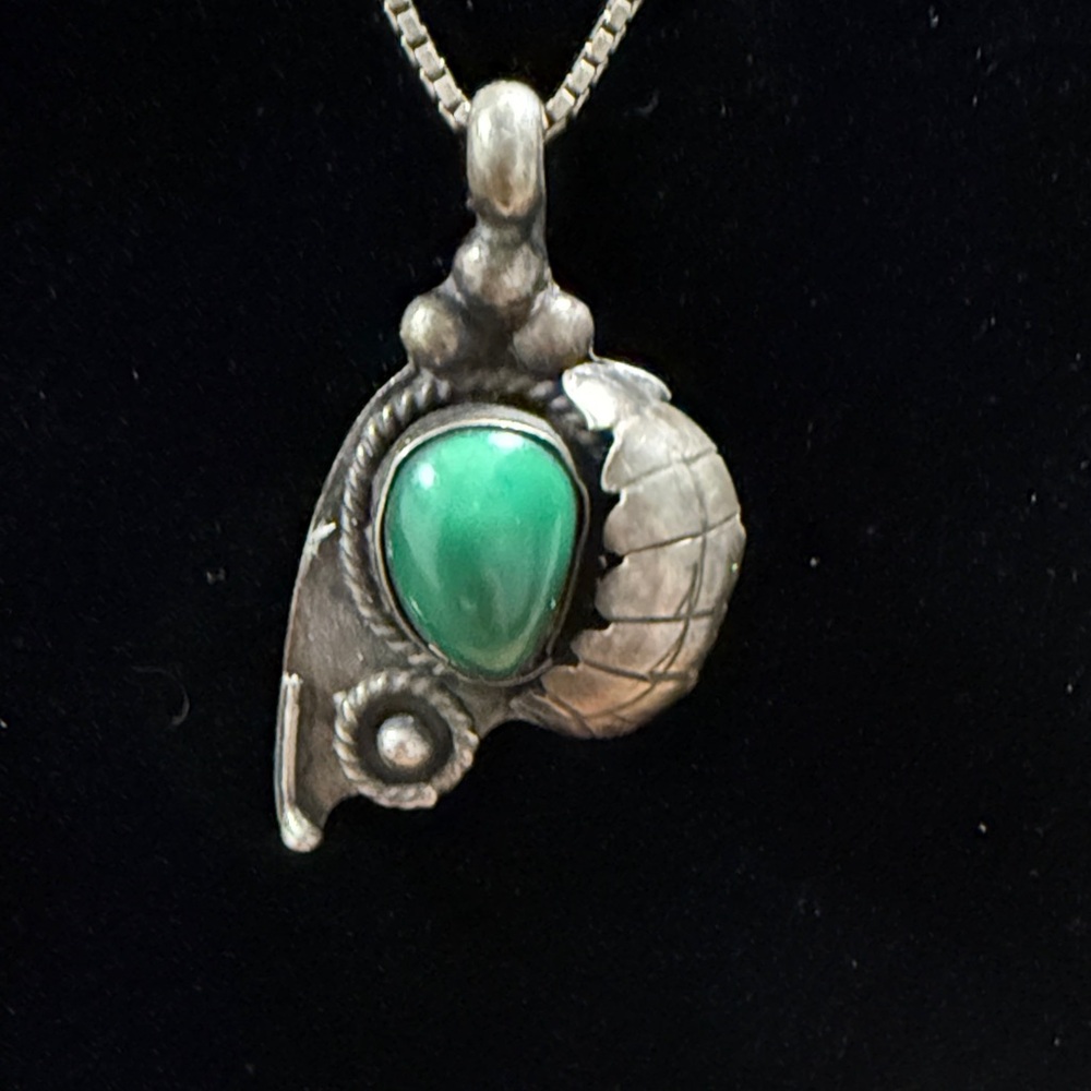 Elegant Silver Pendant with Green Stone